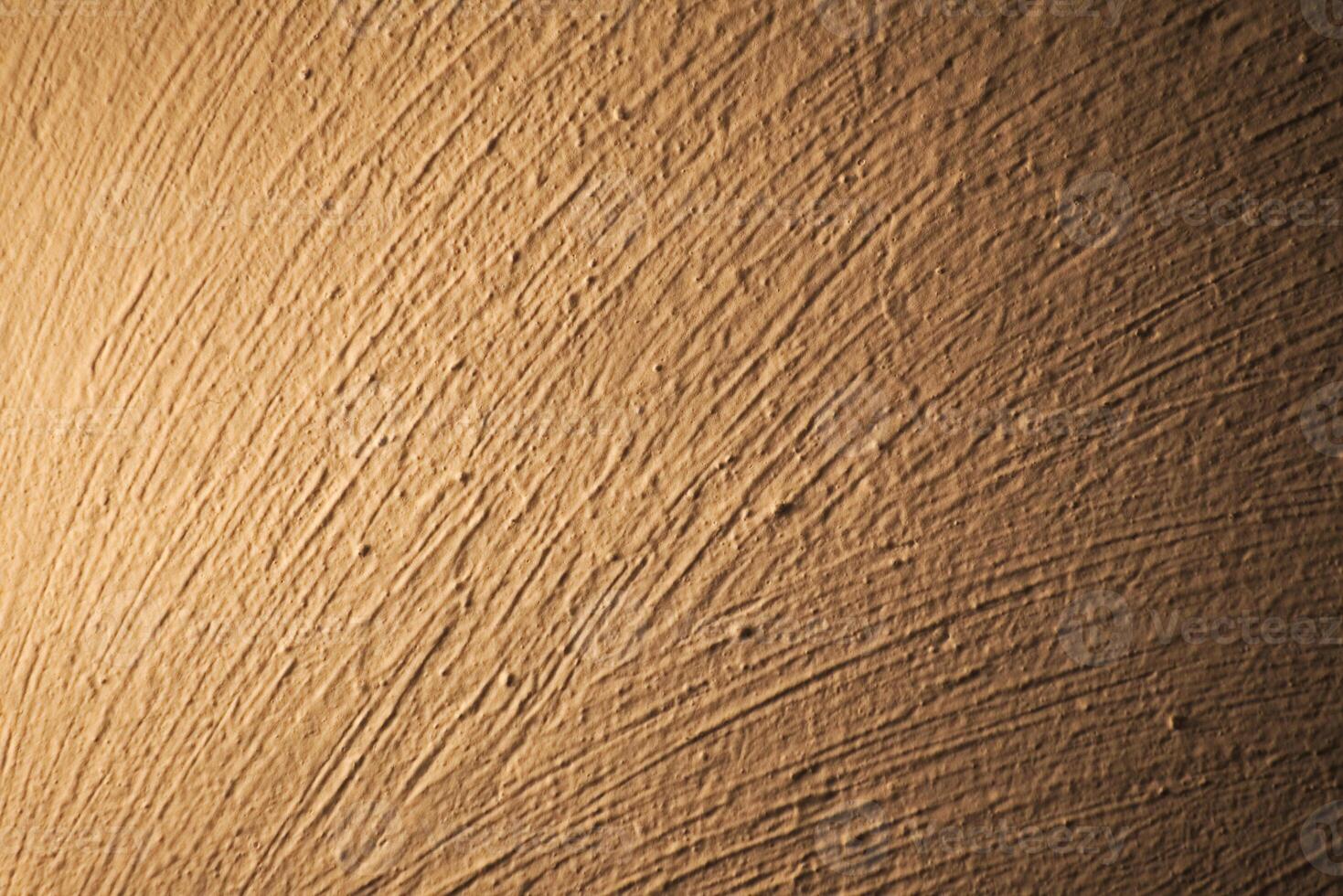 Brush marks on an illuminated white wall photo