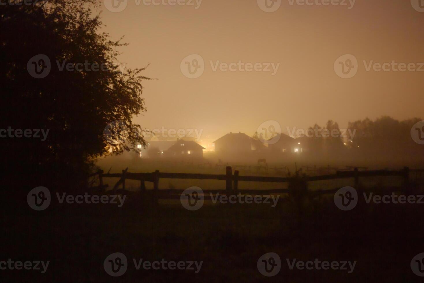 Rural suburb of Greifswald, Mecklenburg-Vorpommern, Germany, covered in fog and mist in the evening. photo