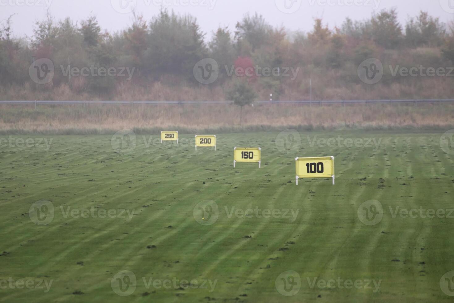 Range markings - in meters - on a golf course. photo