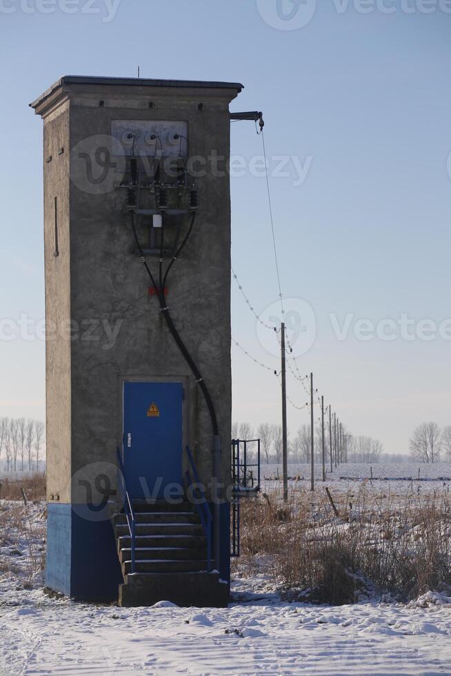 Small German switchgear building in a winter landscape near Greifswald, Mecklenburg-Vorpommern. photo