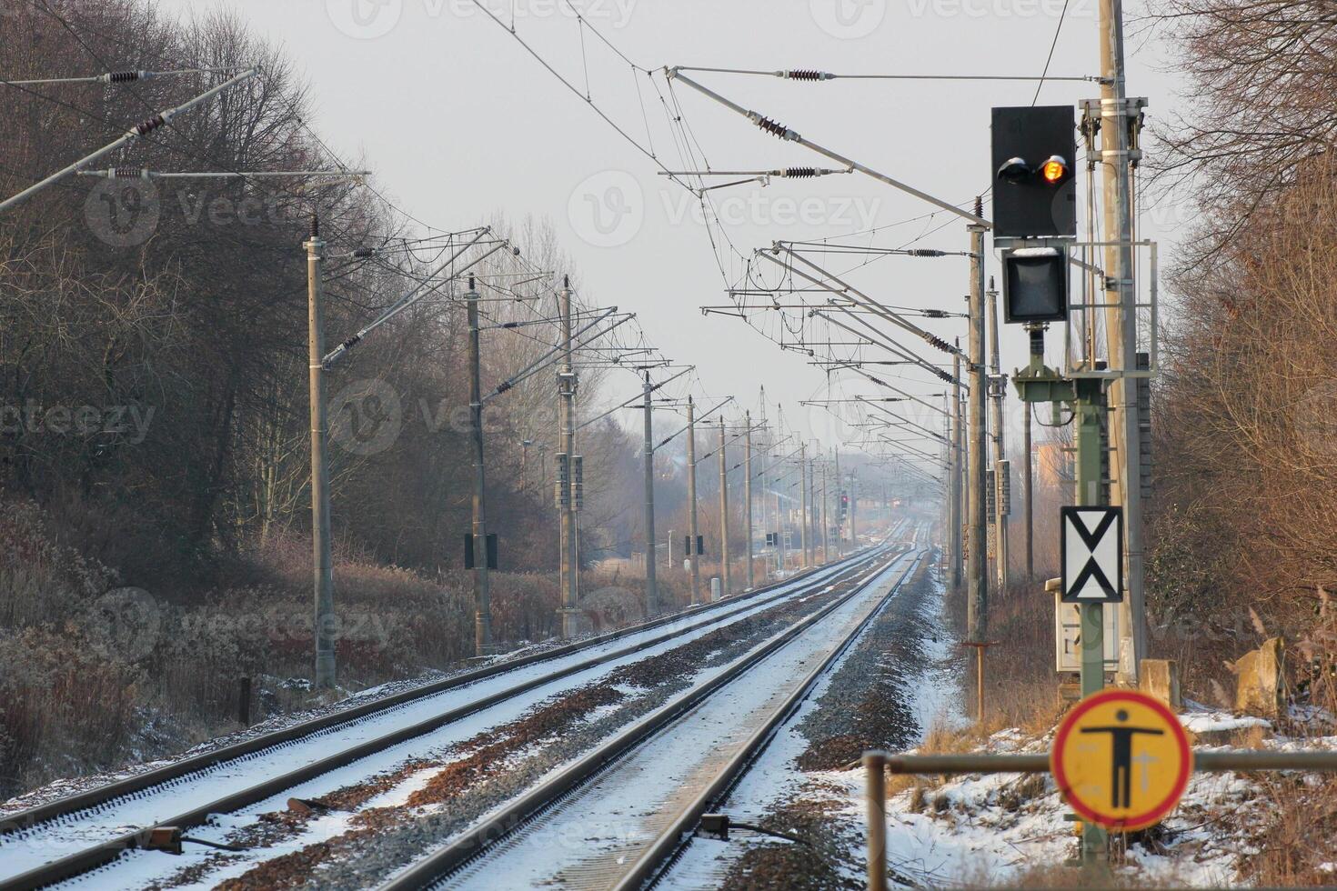 Snowy railtrack in Germany in winter on a winter day. photo