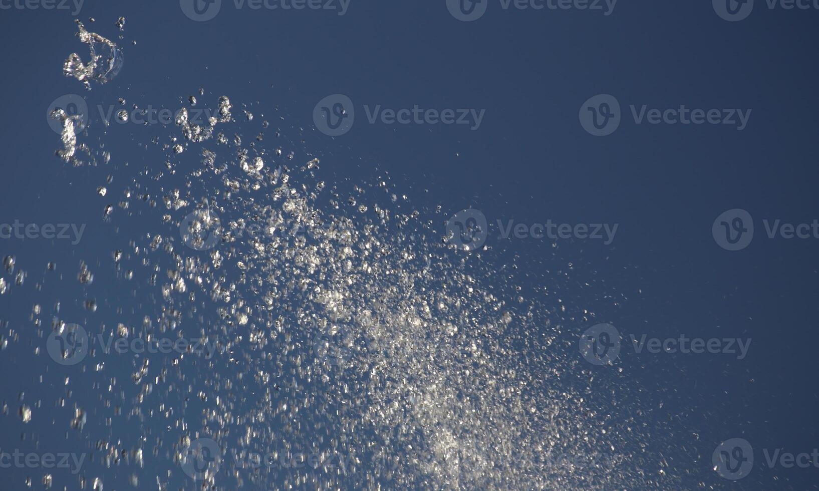 Water drops spraying from the fountain. photo
