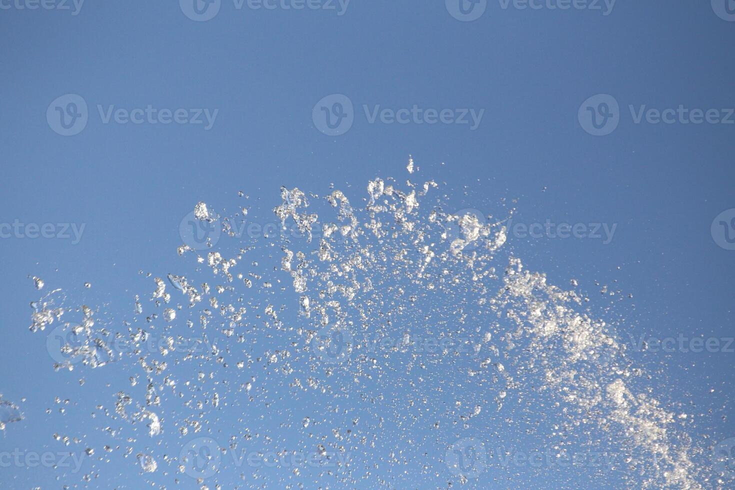 Water drops spraying from fountain. photo