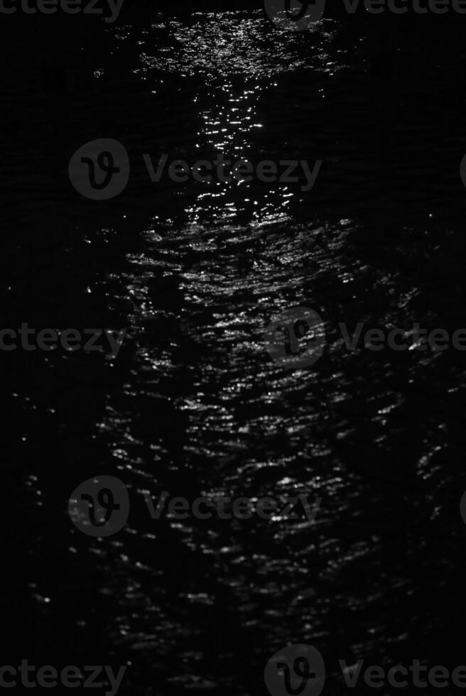 White light effect on water in hourglass shape. photo