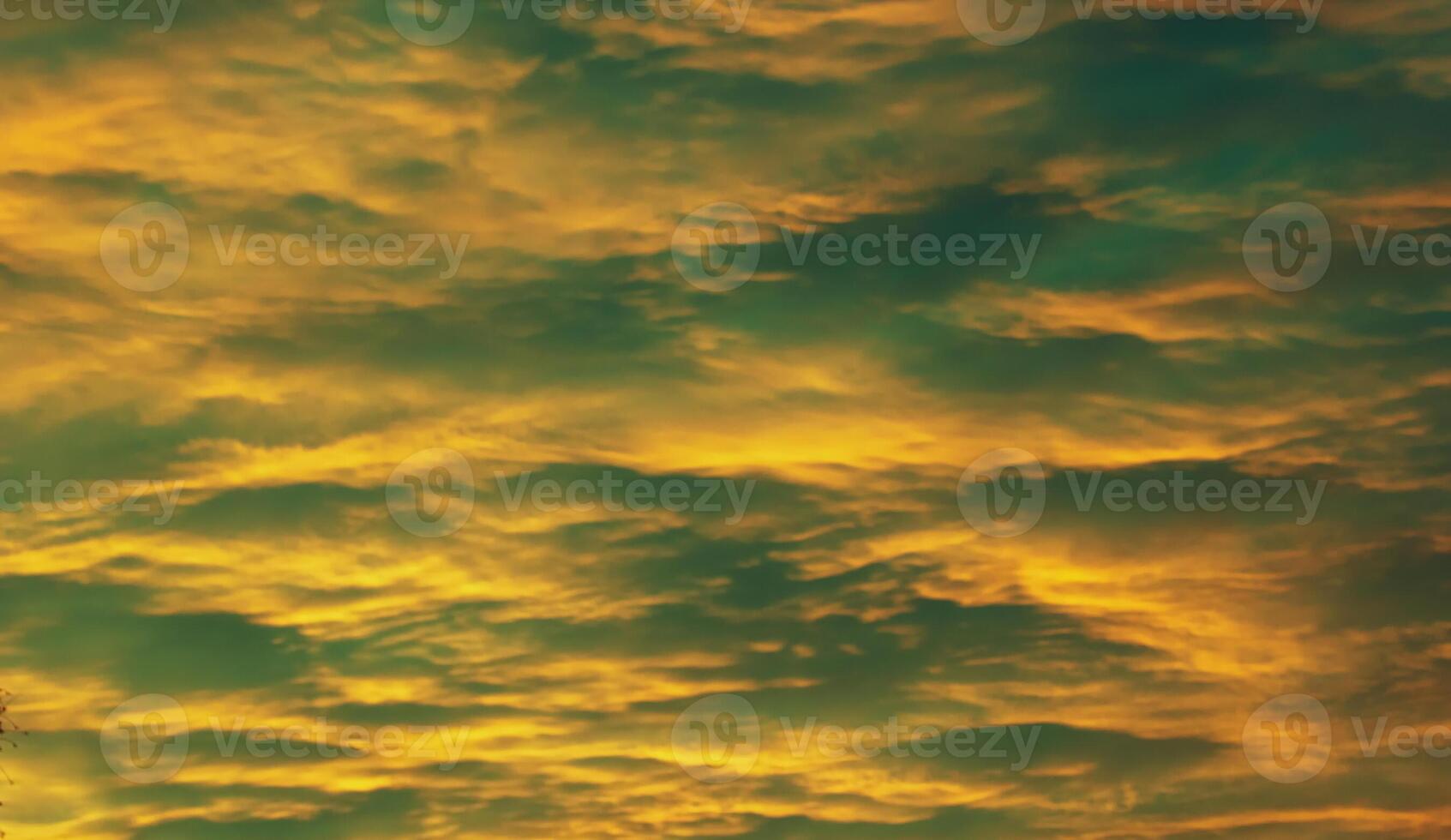 Impressive yellow and green cloudscape in the evening photo