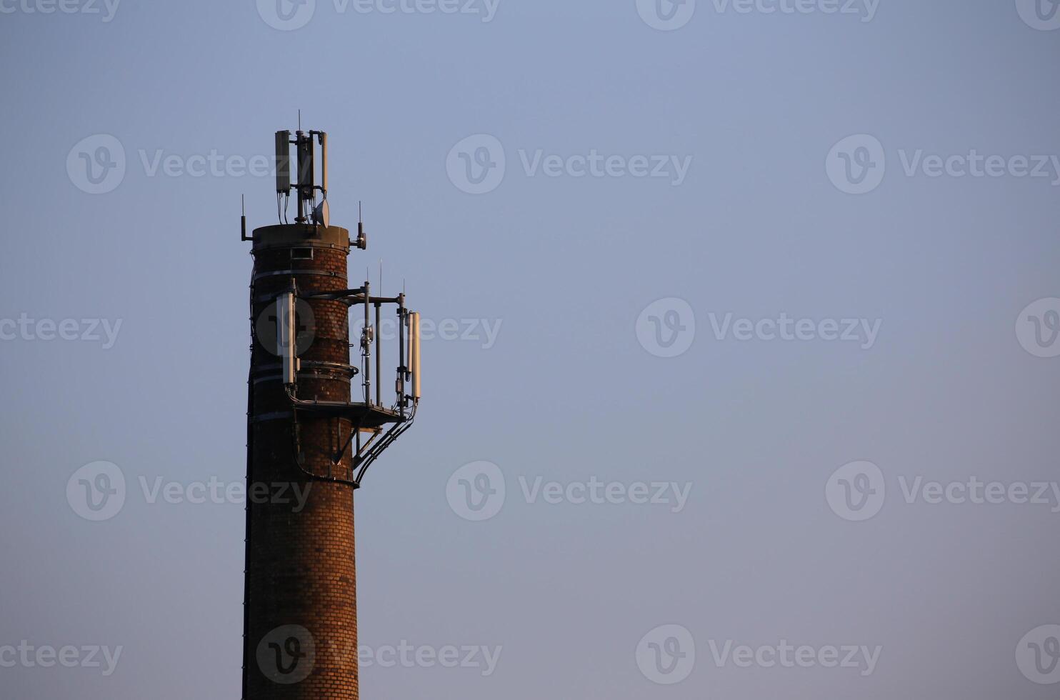 Old chimney used as a base for radio transmitters. photo