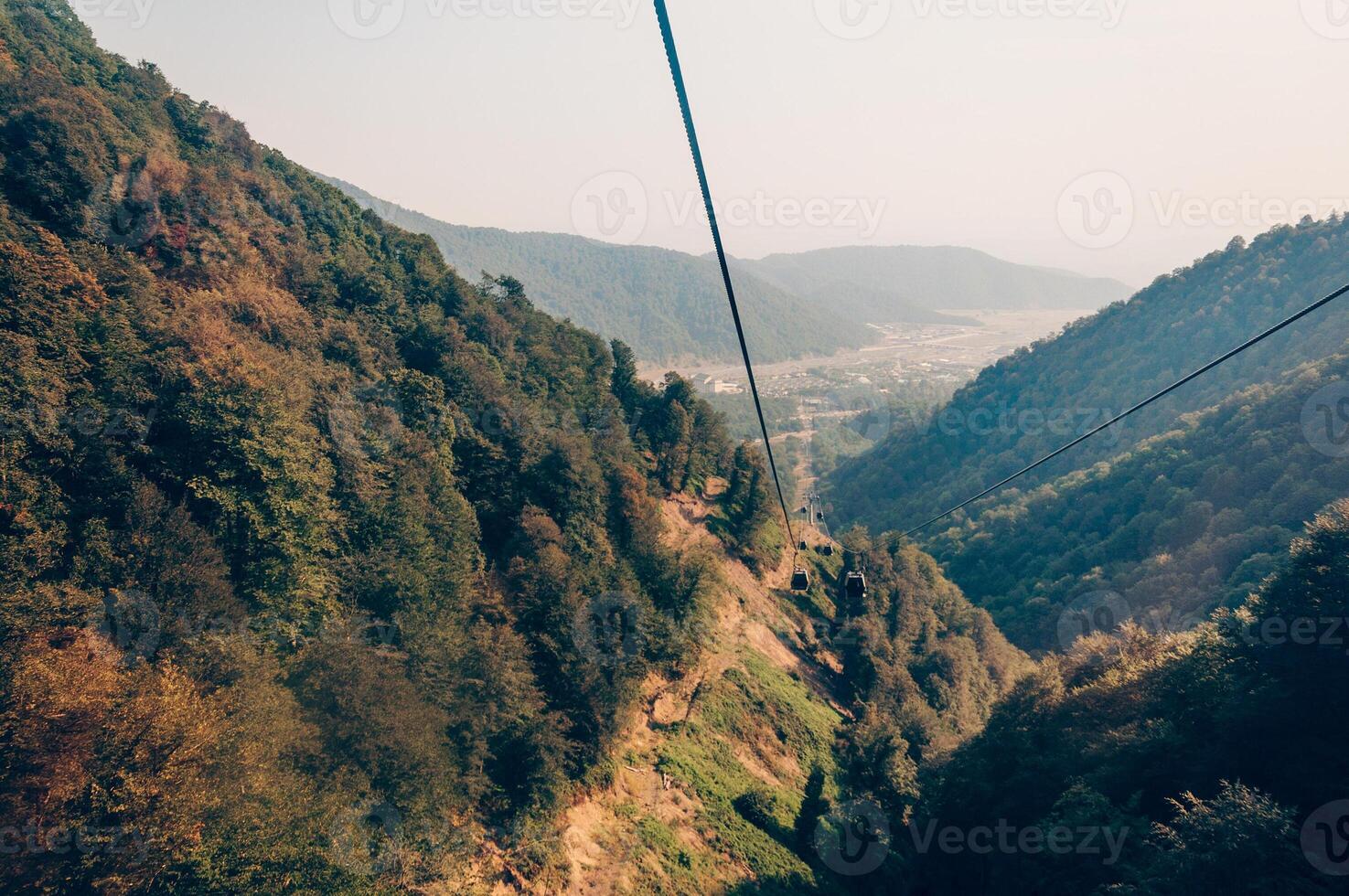 Landscape snowy mountains, tall mountain range in haze summer photo