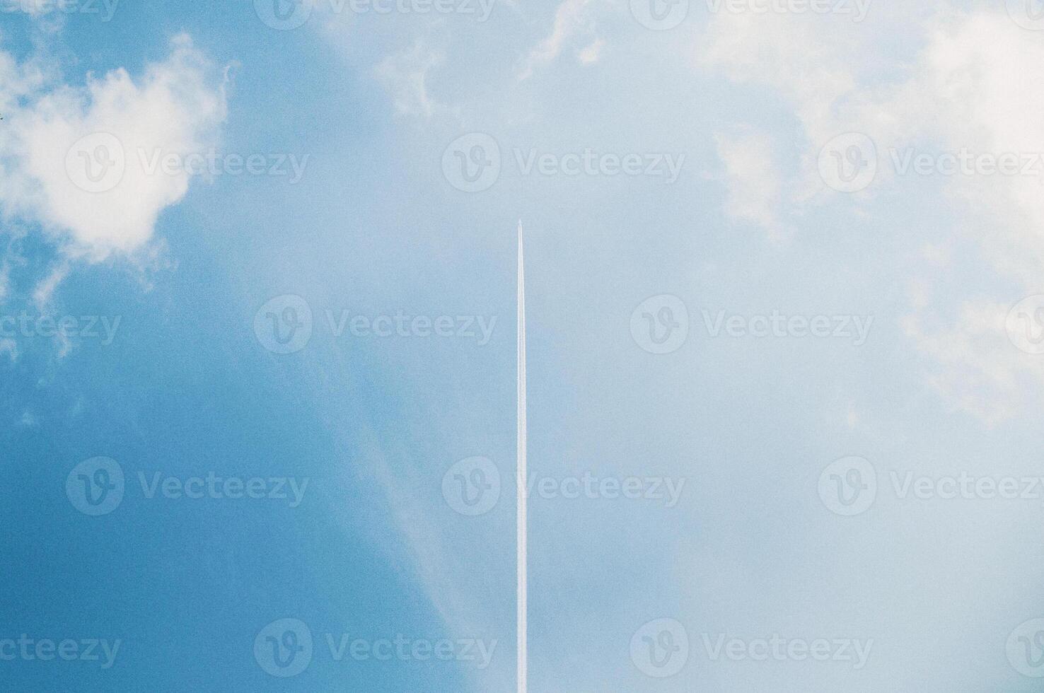 Plane flying blue cloudy sky, air transport, sunny day, fluffy clouds photo