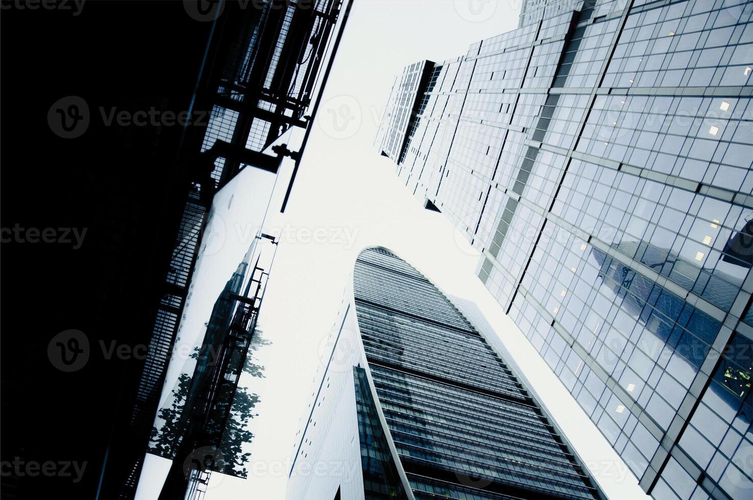 Glass quiet tall blue skyscrapers center big city, buildings background cloudy day sky photo