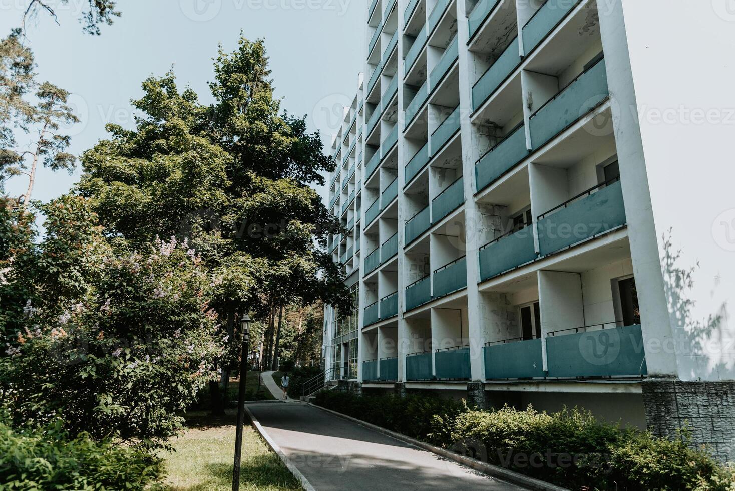 Multi quiet storey residential building suburb city, house background sunny summer day photo