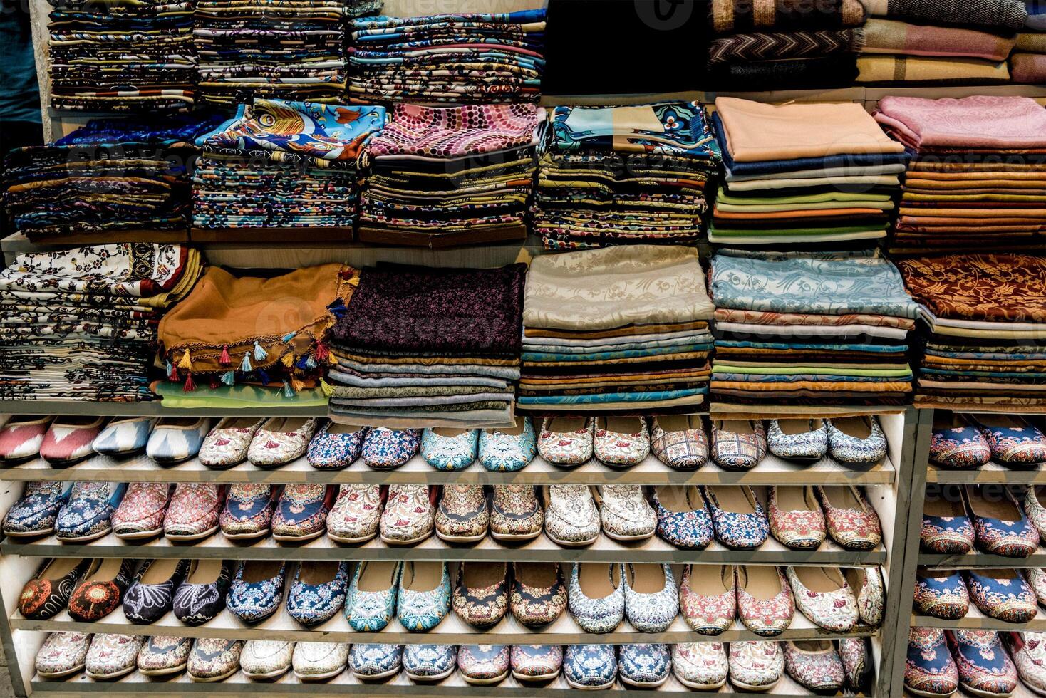 Eastern Market sells local traditional clothes, lovely fabrics on shelf of store photo