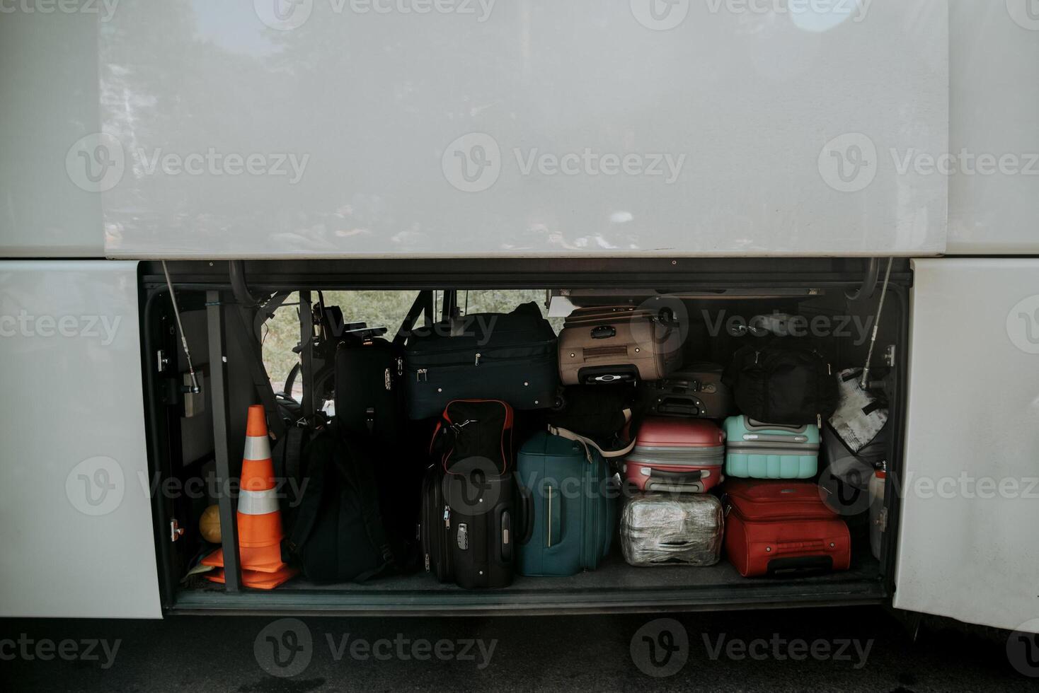 Suitcases of tourists loaded in trunk of bus, transport shuttle tour vacation photo