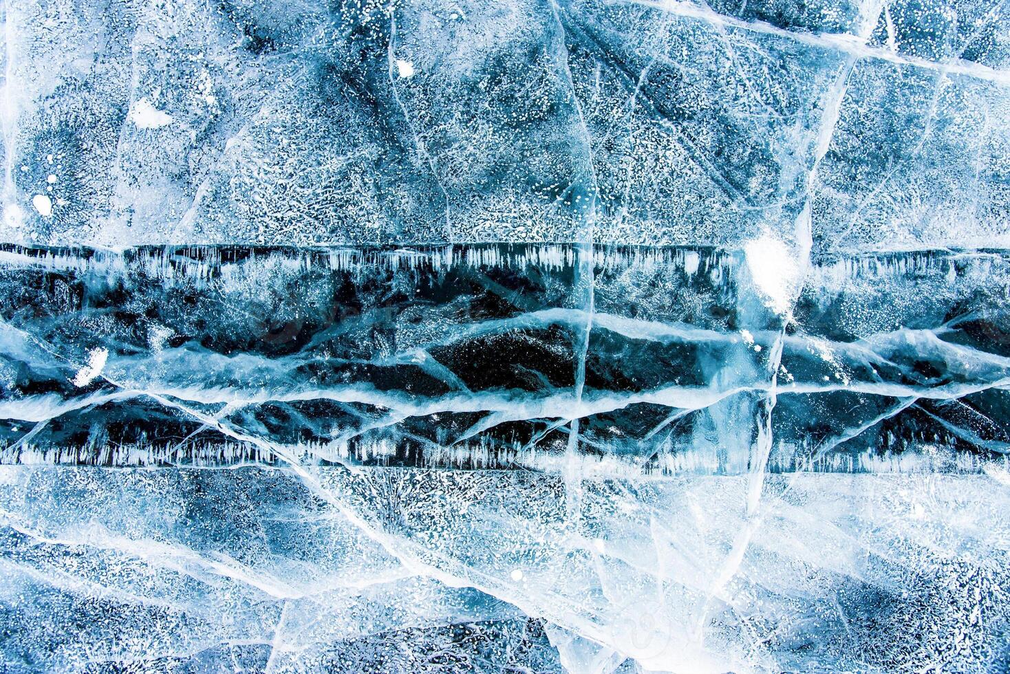 Deep blue ice texture, lake water frozen in winter, cold icy wallpaper, white snow photo