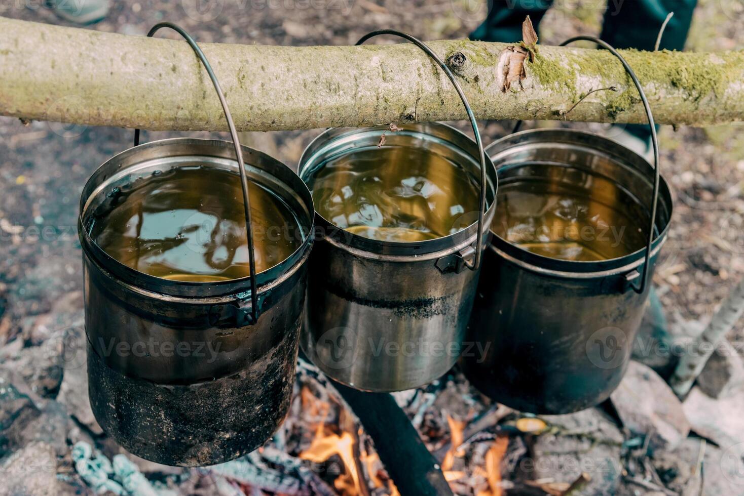 Camping Kitchen journey Travelers Camp Cooking Food in Pots on Campfire photo