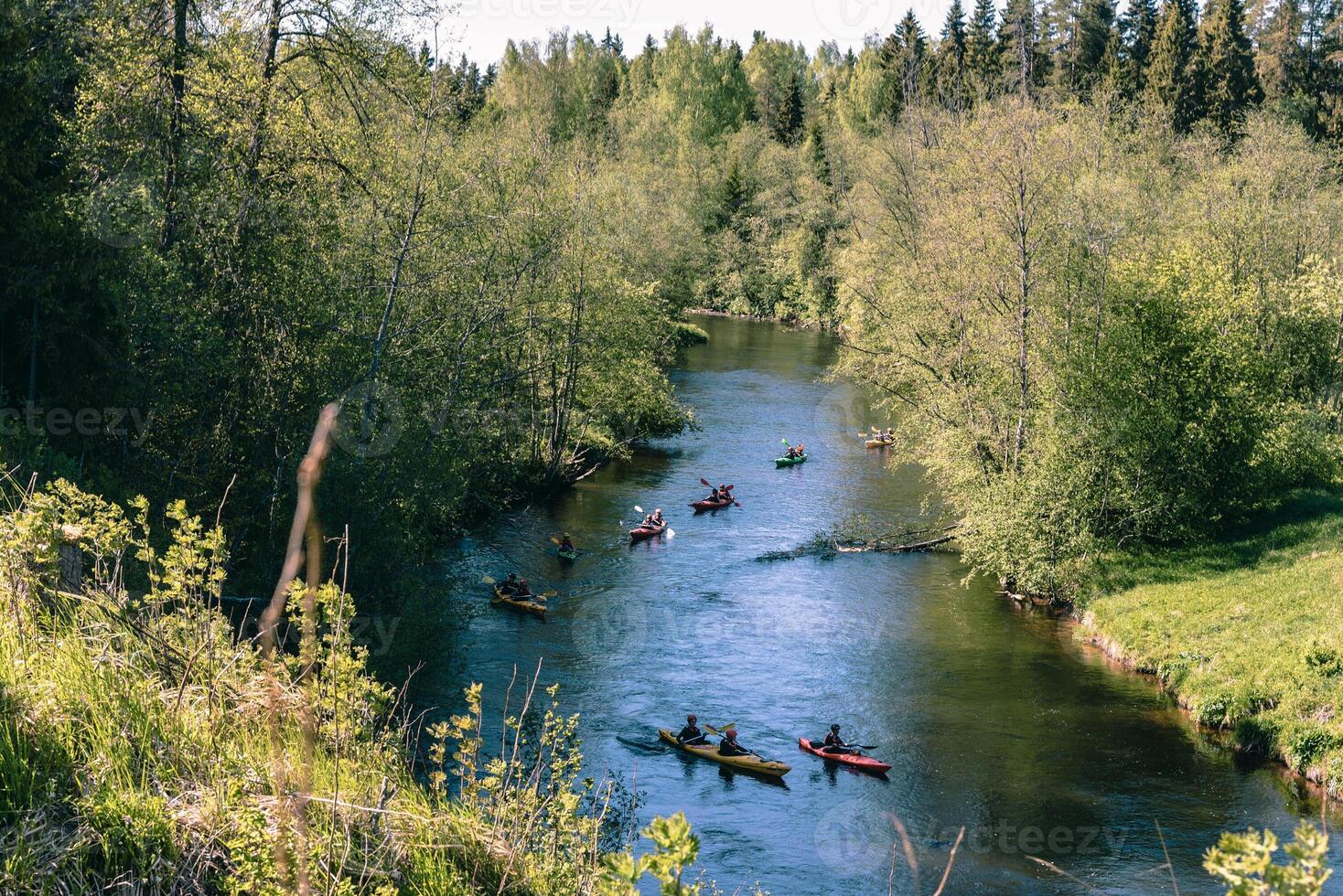 Active holidays on lake, kayaking on water, journey tourism on cloudy day photo