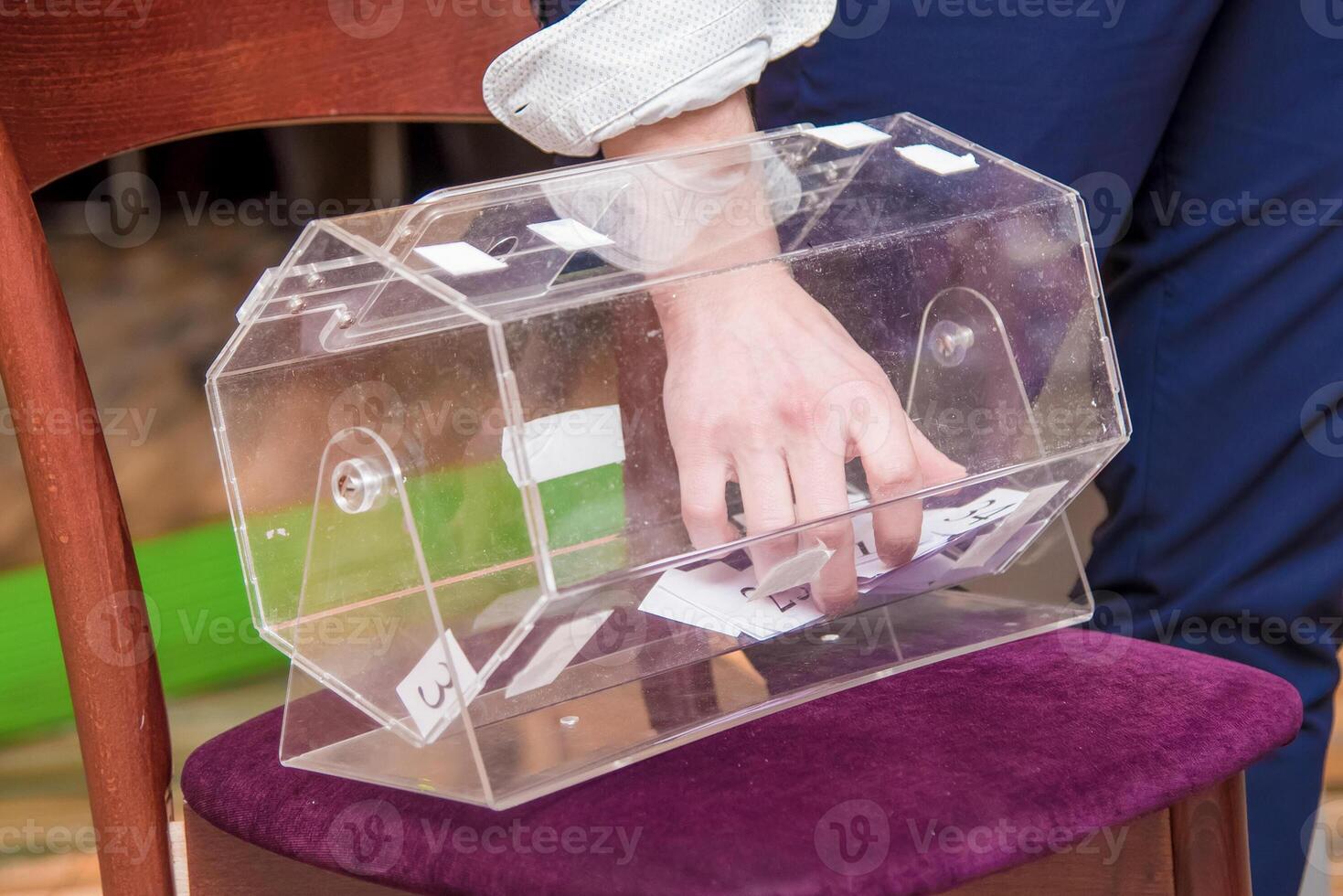 Lottery drum handsome with player winning numbers, prize drawing, game of luck photo