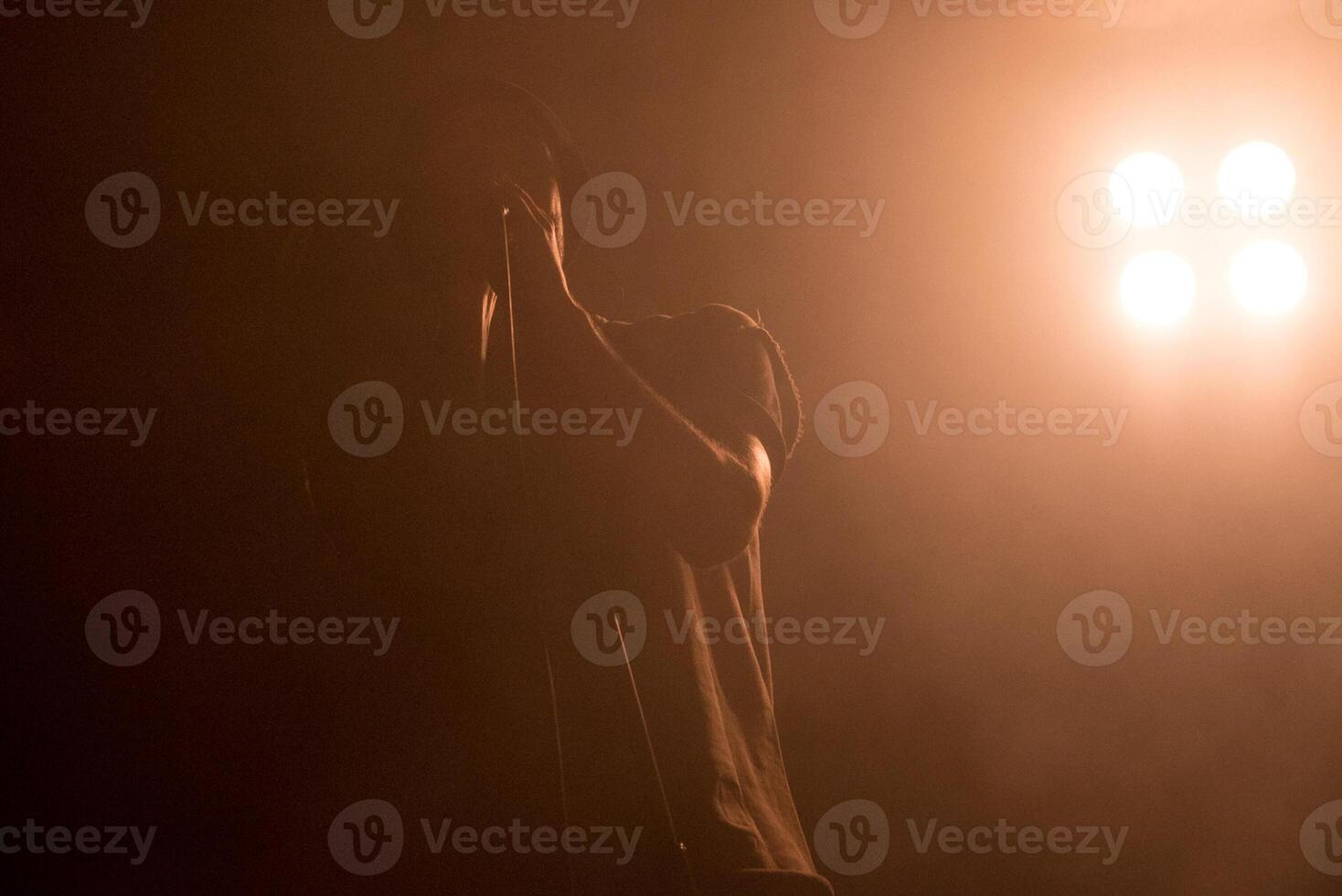 Man nice vocalist sing, musician singer performs at concert in nightclub bar photo
