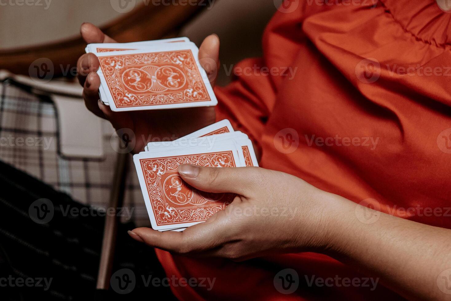 Magician show card trick, nice man play casino gambling, close up hands holding deck photo