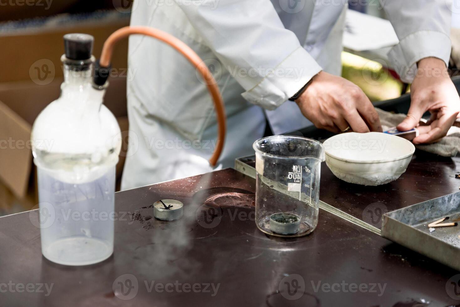 Scientist in laboratory smart pour liquid glass flask, assistant conduct an experiment photo