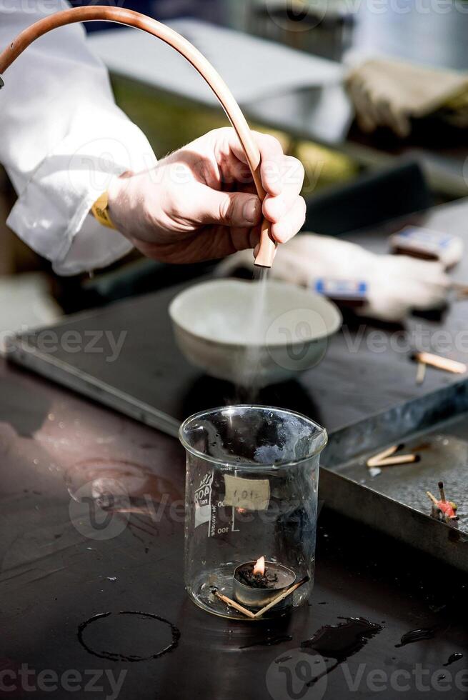Scientist smart in laboratory pour liquid glass flask, assistant conduct an experiment photo