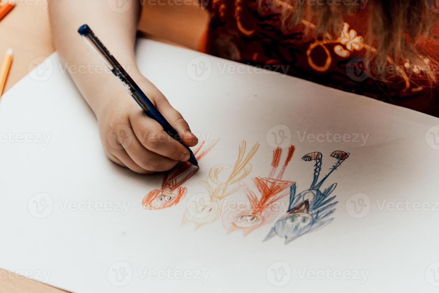 Child nice draw colored pencil on paper, kid in kindergarten, preschool education photo