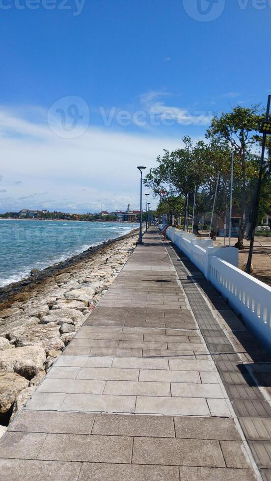 A Pathway blue sky with white clouds photo
