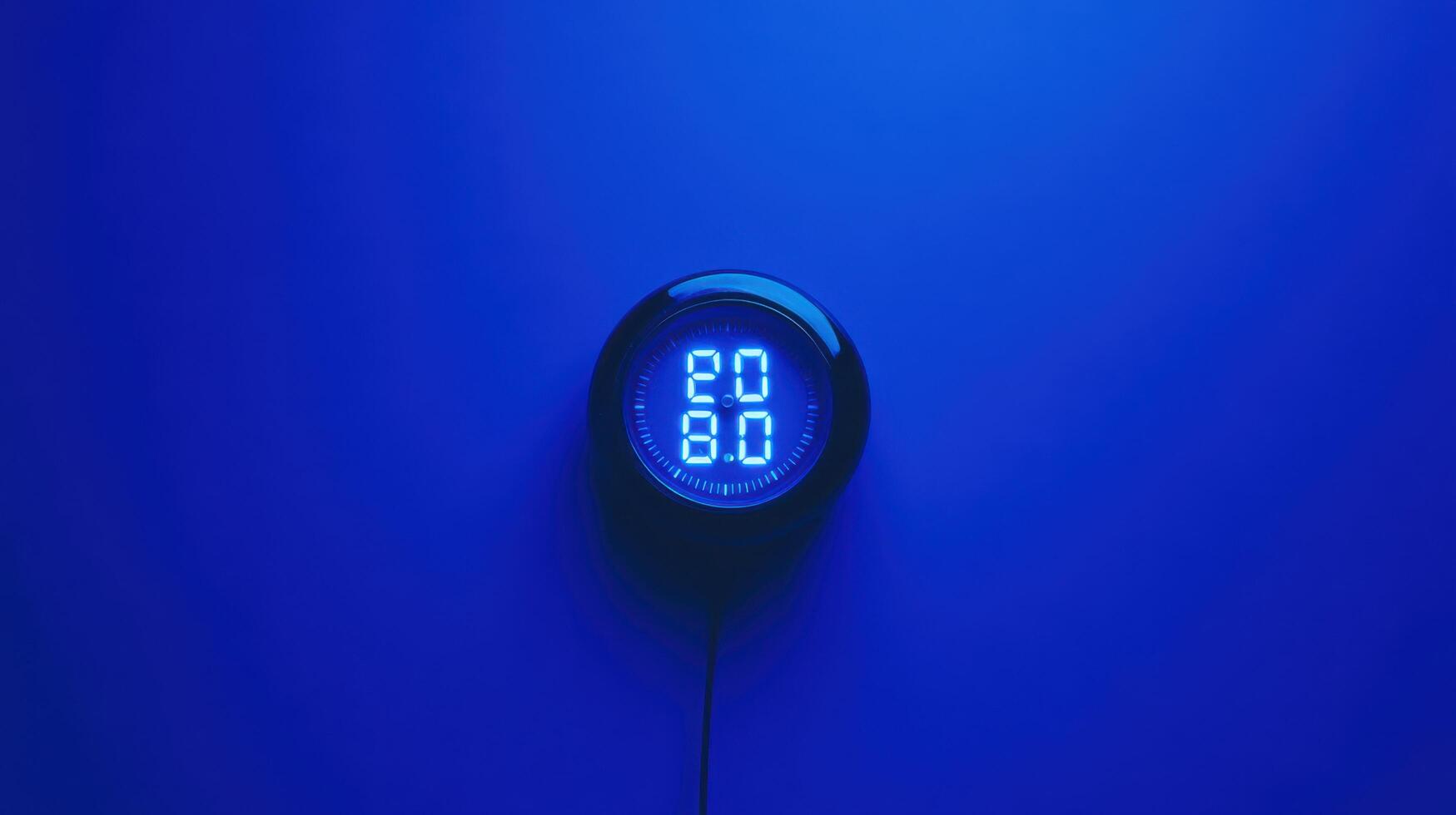 Digital display with blue background showing temperature and humidity readings in a modern environment photo
