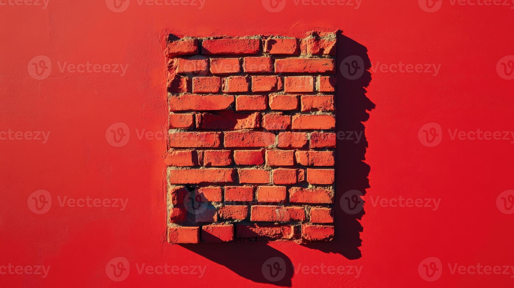Exposed brick wall section revealing texture against a vibrant red background photo