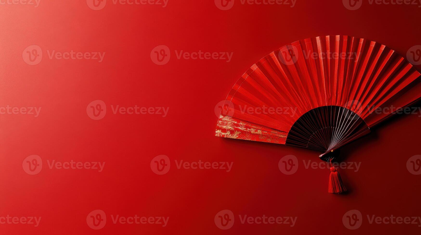 Elegant red fan displayed against a vibrant background enhances traditional aesthetics and cultural significance photo