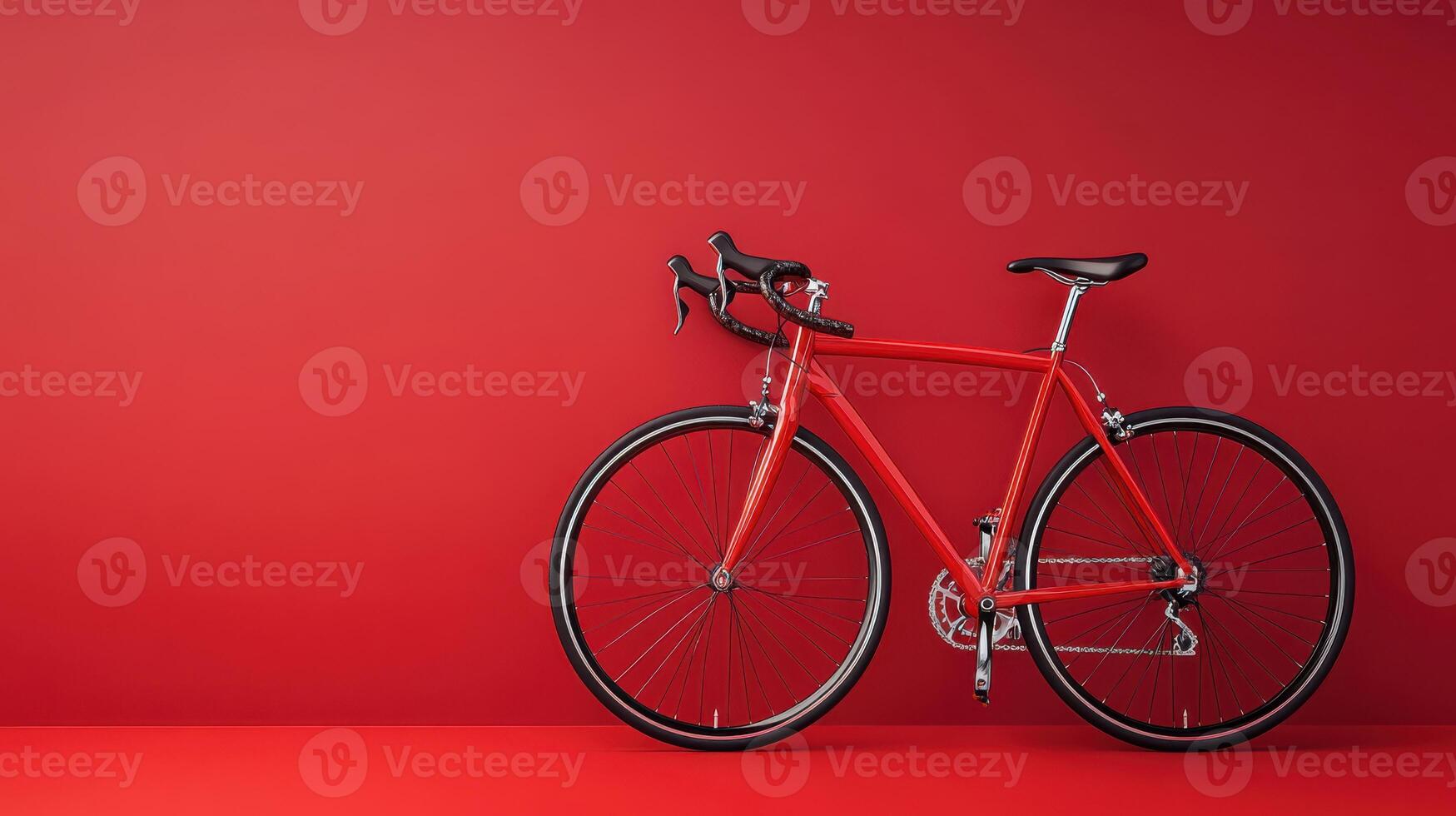 Bright red bicycle leaning against a vibrant red wall in a minimalist setting, showcasing design and color contrast photo