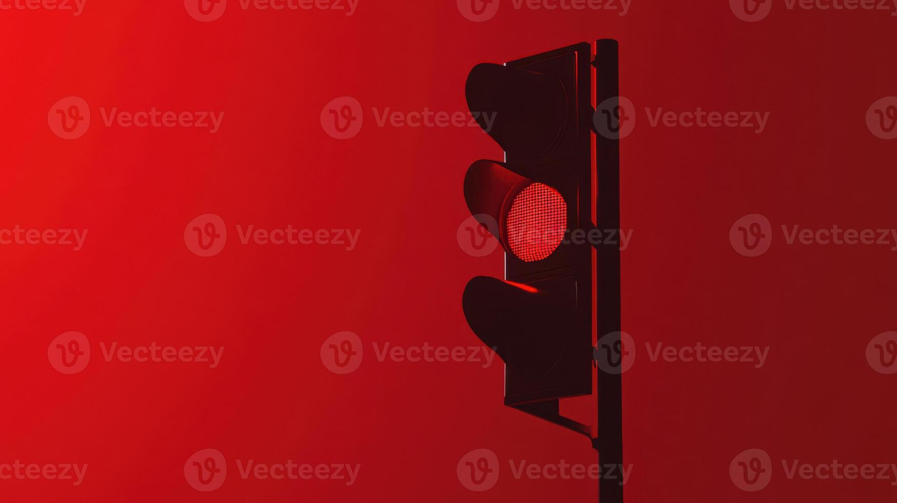 Red traffic light against a vibrant background signaling vehicles to stop at a busy intersection in the city photo
