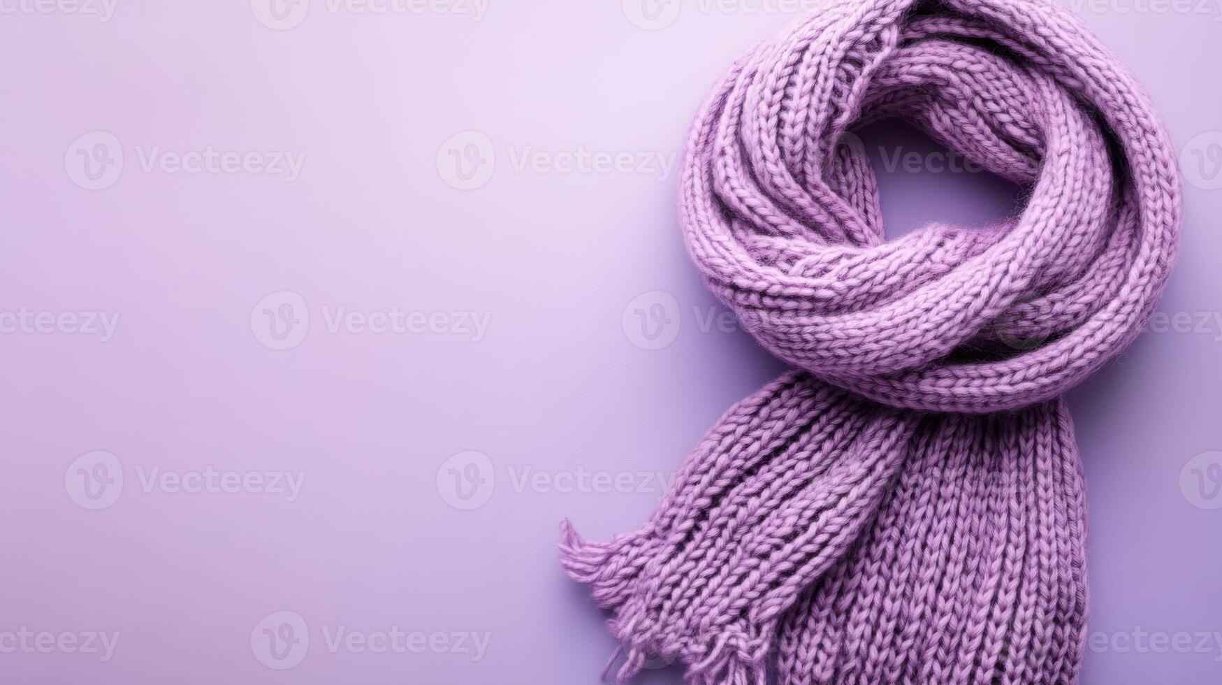 Soft lilac scarf neatly arranged on a pastel background creating a cozy and inviting atmosphere for winter fashion lovers photo