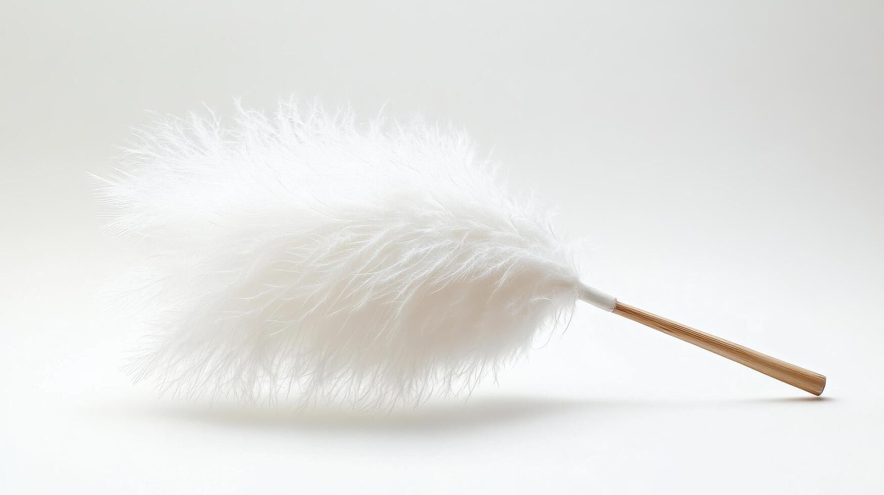 Soft white duster with a wooden handle for cleaning tasks in modern interior settings photo