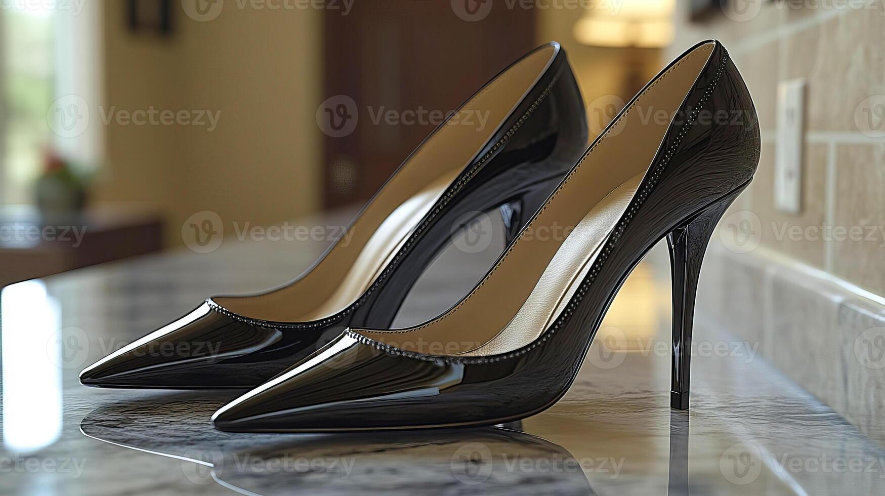 A pair of black stiletto heels on a marble countertop photo