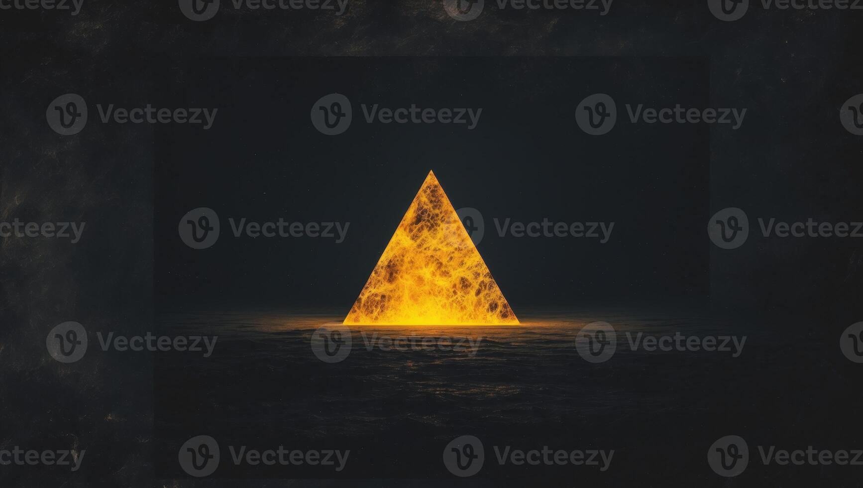 A fiery triangle illuminating the dark background photo