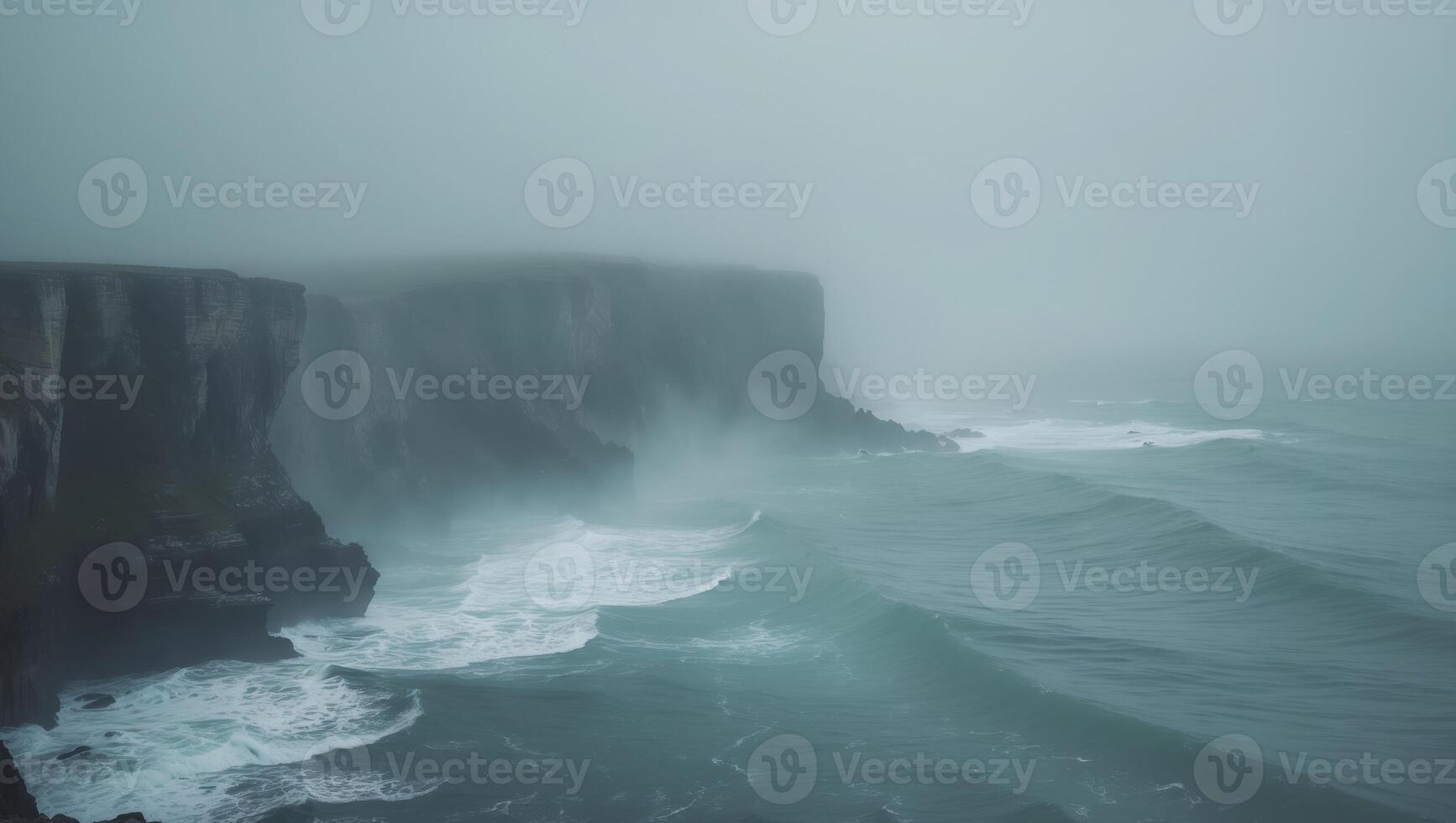 a view of cliff and water overlooking the ocean in the foggy fog photo
