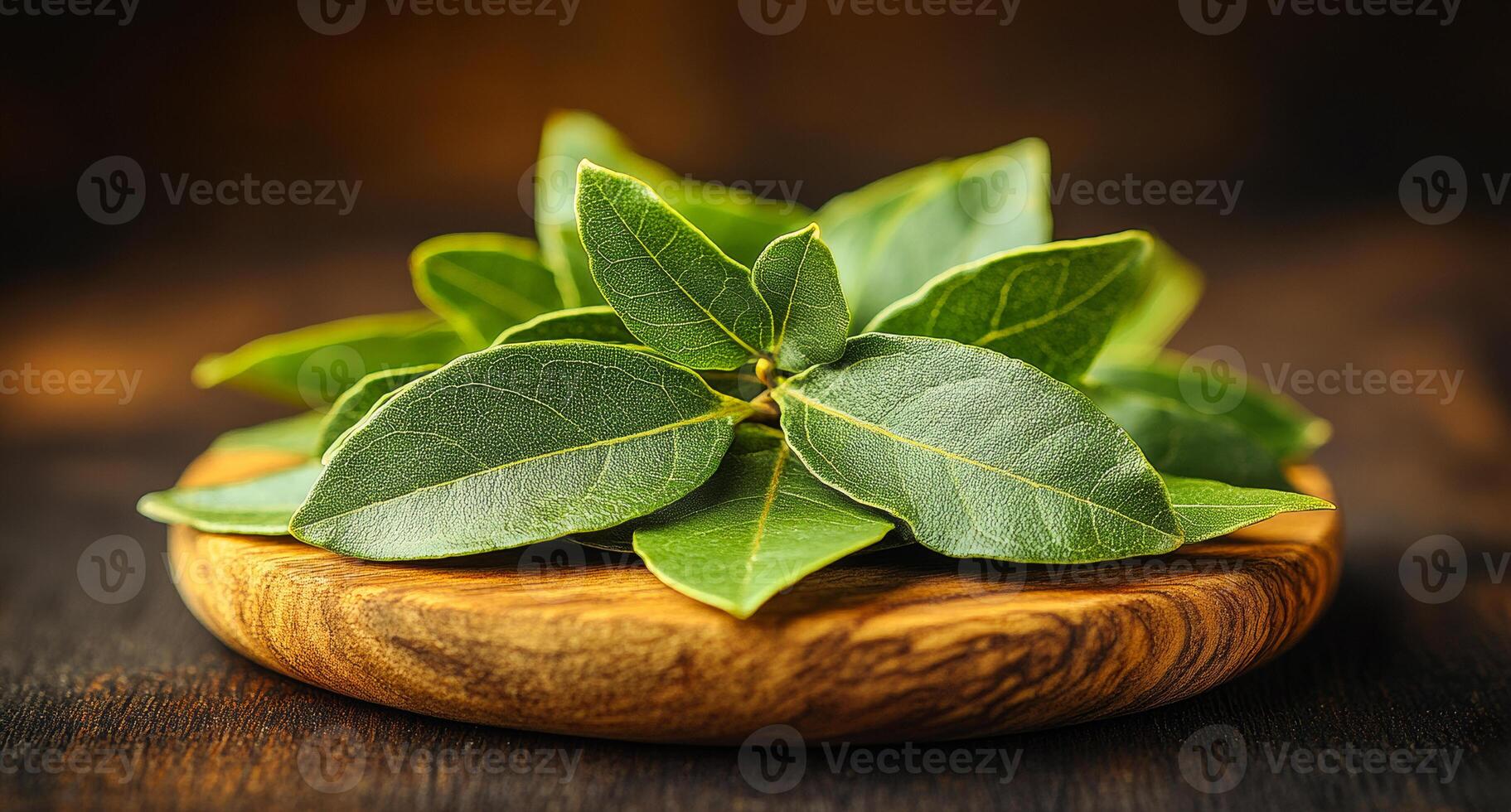 A bunch of green leaves are on a wooden plate. The leaves are fresh and appear to be from a herb photo