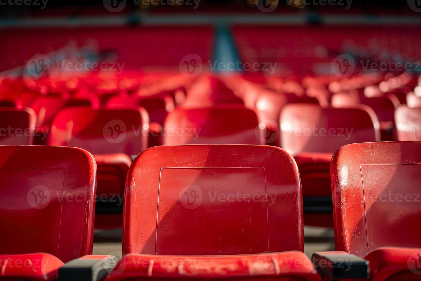 Vibrant red stadium seats are arranged in neat rows, ready for enthusiastic fans during a thrilling sports event photo