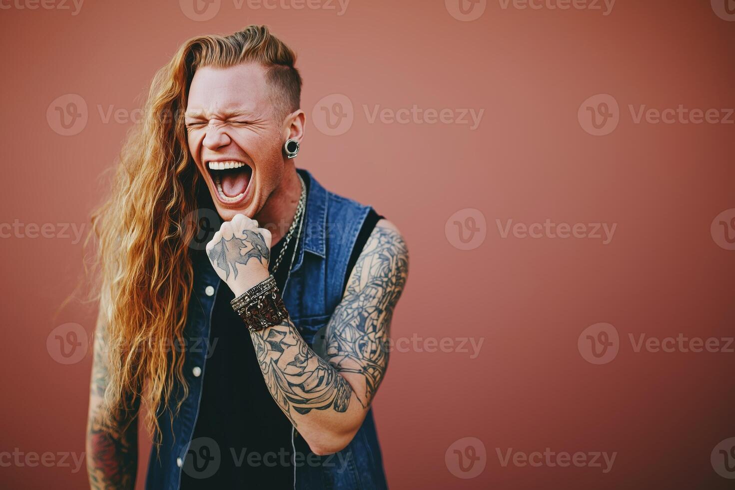 Portrait of joyful drag queen against a vibrant red background showcasing gender fluidity and self-expression photo