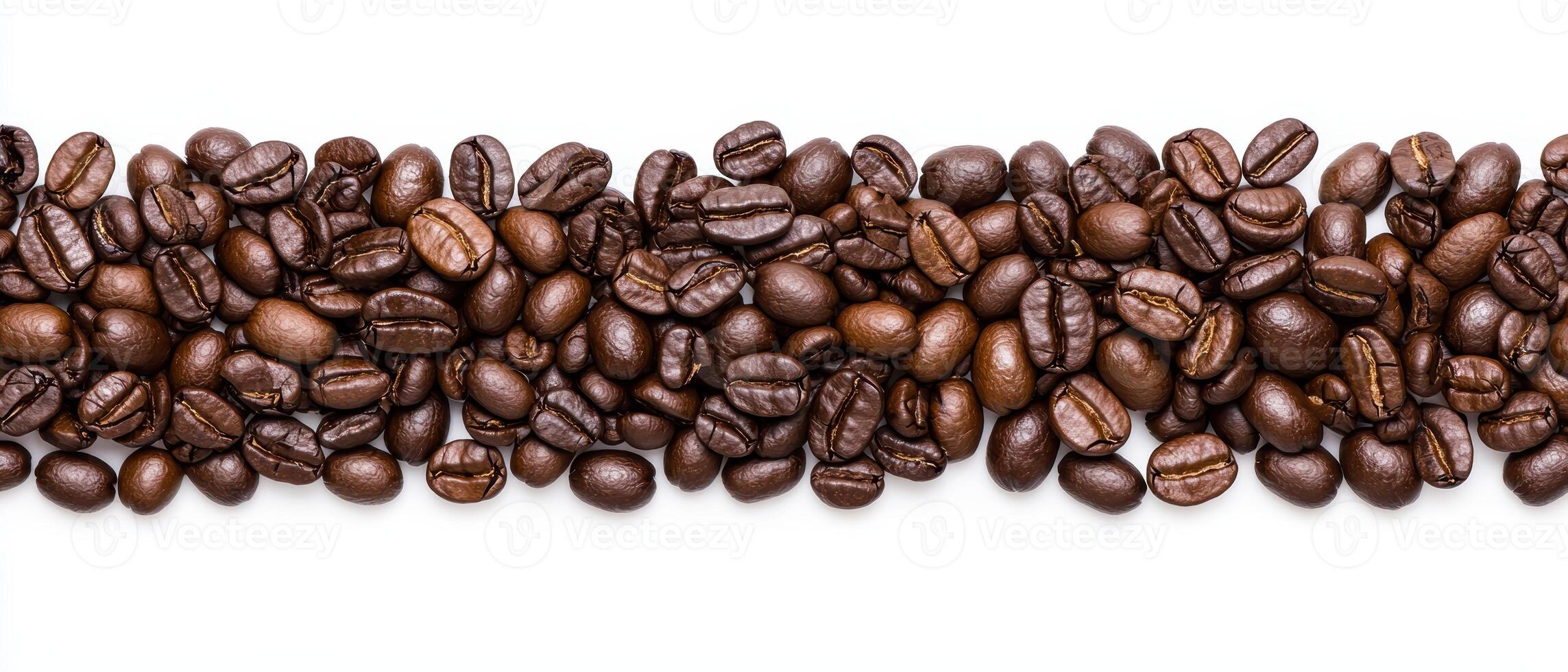 Close up of roasted coffee beans arranged in a row on a white background photo