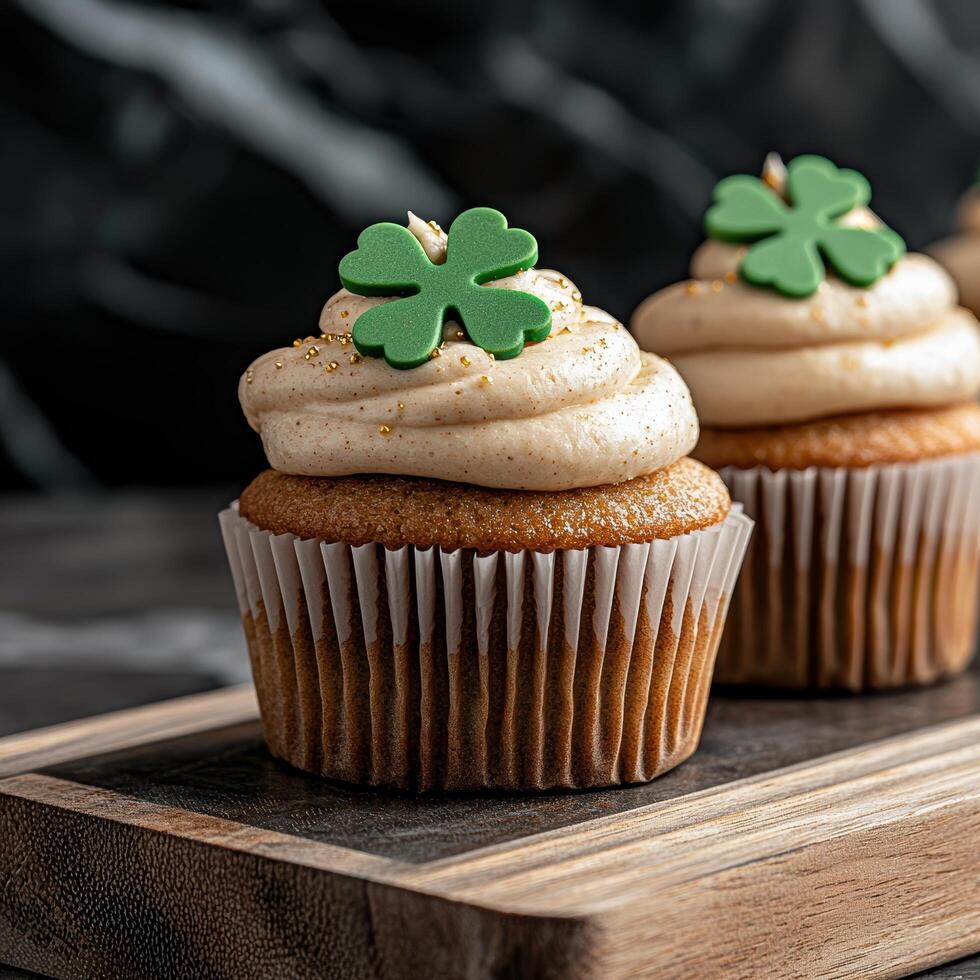 Close up of two delicious St Patricks Day cupcakes with shamrock toppers photo