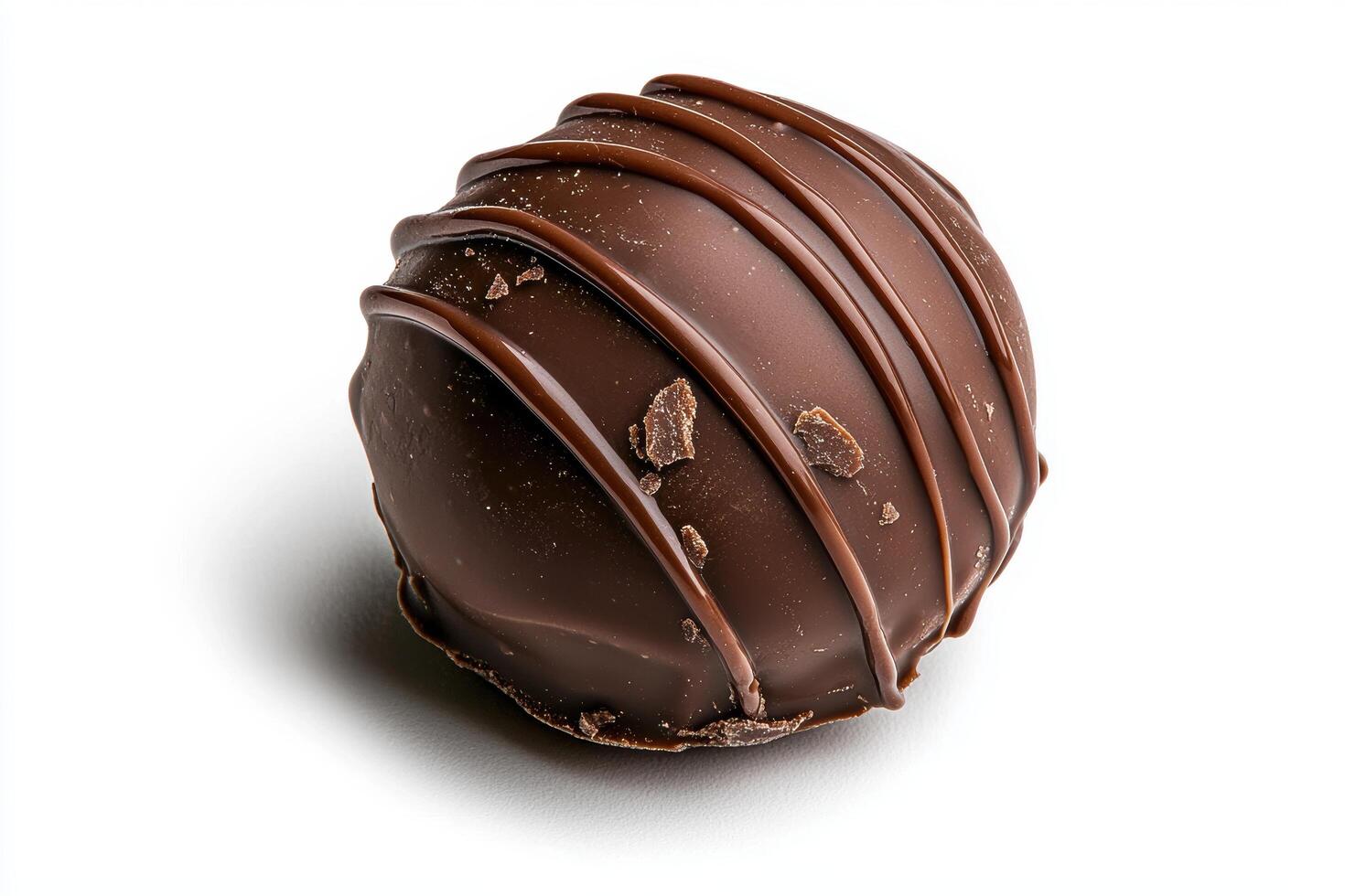 Close up of a single chocolate truffle on white background photo