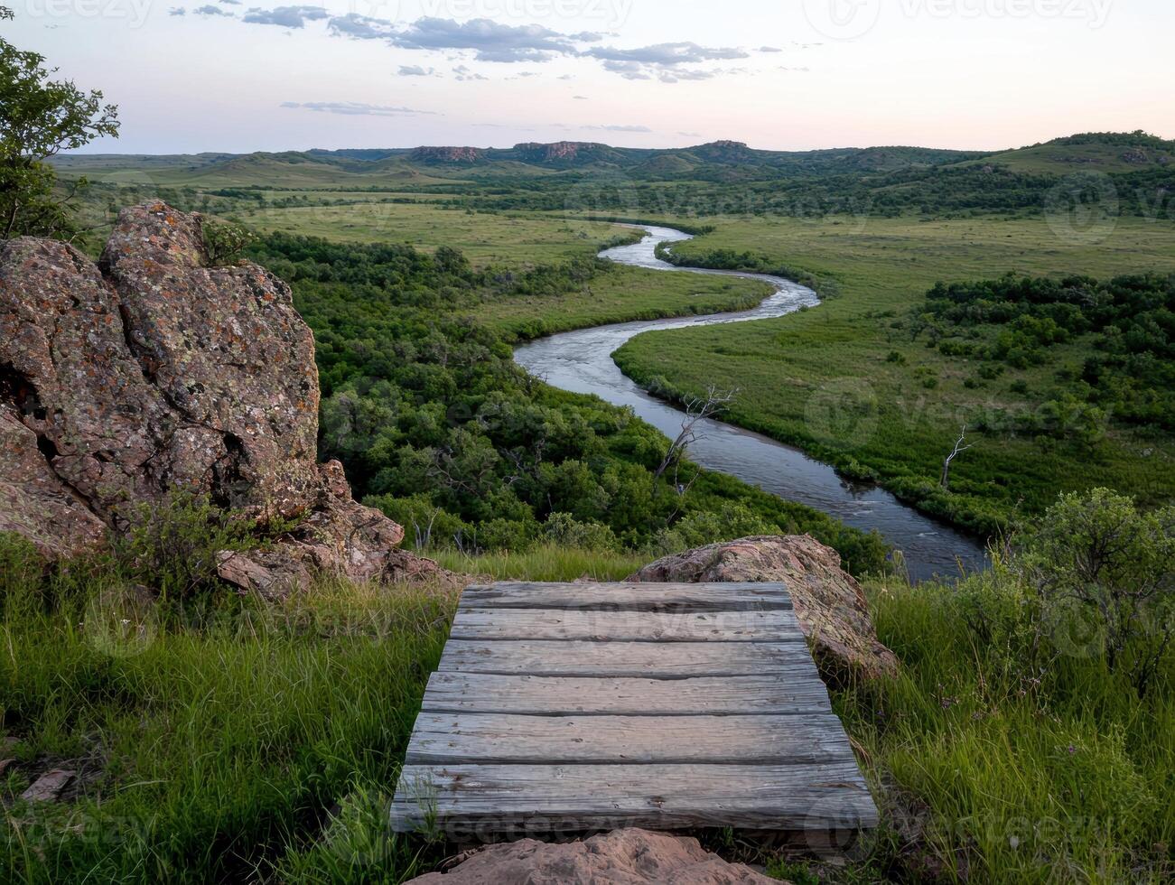 Wooden platform overlooking a scenic river valley photo