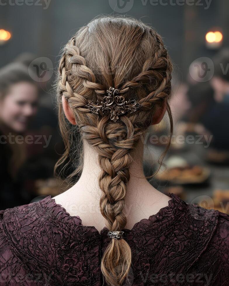 Woman with intricate braided hairstyle and hair accessories photo