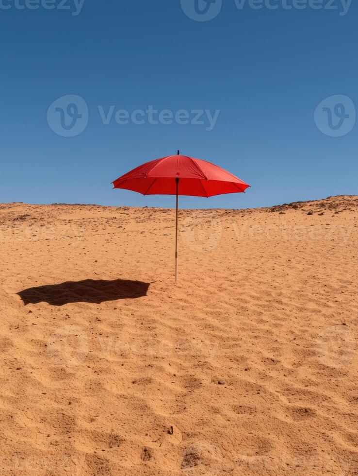 Red umbrella in a desert landscape photo