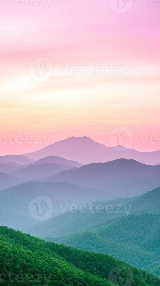 Sunrise Over Lush Green Mountain Range with Pink and Orange Sky in Vertical View photo
