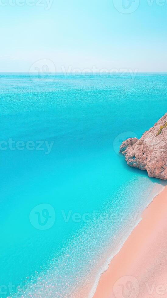 Vertical Screen of Magnificent Blue Ocean Shore with Turquoise Water and Sandy Beach from a High Viewpoint at a Picturesque Coastal Location on a Clear Day for Nature Lovers and Travel Enthusiasts photo