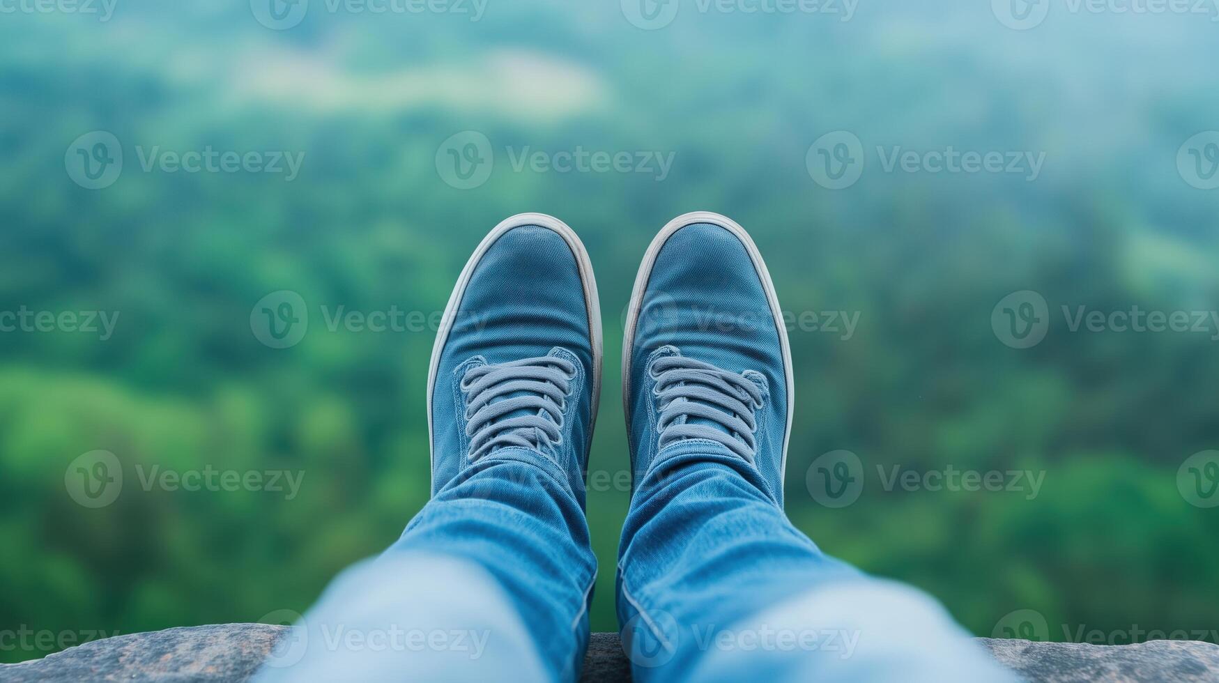 Overcoming Challenges with a Fresh Perspective with Blue Sneakers Overlooking a Verdant Forest, Reflecting on Life Journey and Embracing Personal Growth in a Metaphorical Adventure Setting photo