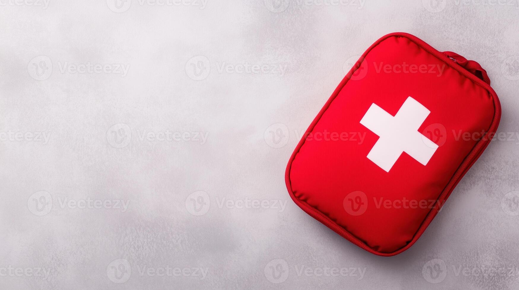 Red First Aid Kit on Gray Background Isolated for Medical Emergency Safety, Health Care Preparation, Survival Essentials with Copy Space for Text in Minimalistic Design and Modern Style photo