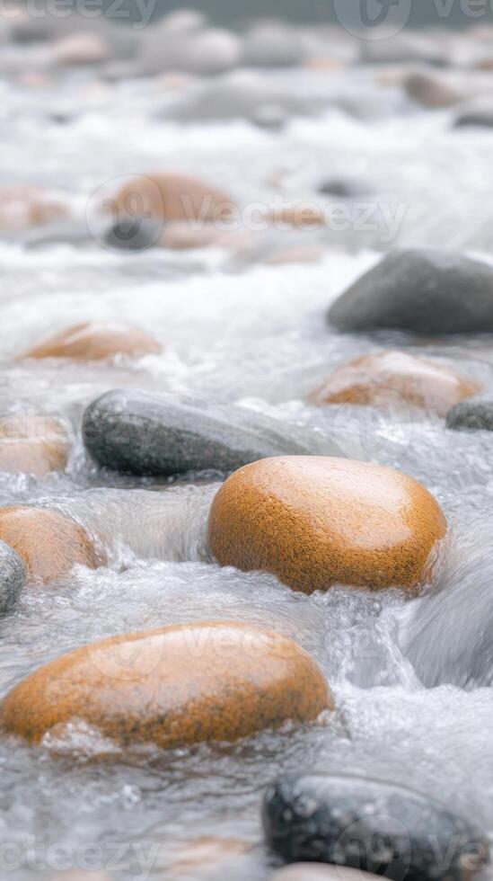 Serene River Flow Over Smooth Stones in a Calming Natural Setting with Gentle Water Movement and Peaceful Rocky Stream in Vertical Orientation, Perfect for Nature Relaxation and Meditation Themes photo